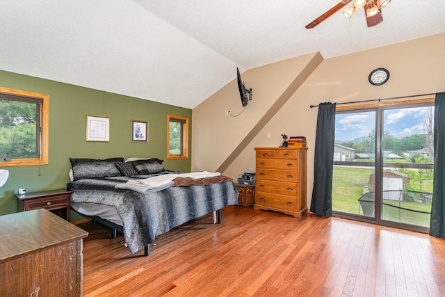 W7340 163rd Ave, Hager City, WI 54014 - bedroom with access to exterior, light wood-style floors, multiple windows, lofted ceiling, and a ceiling fan