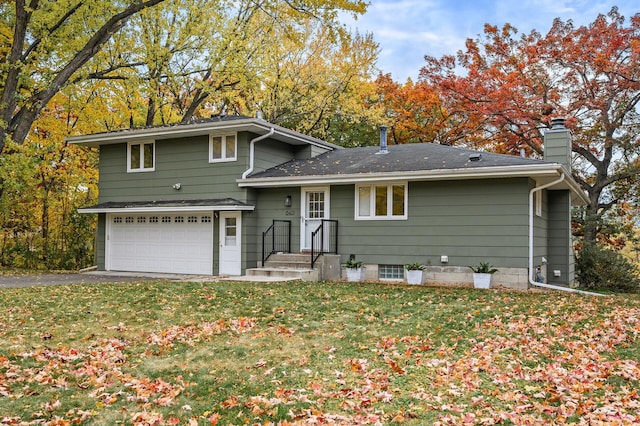 8401 Meadow Lake Rd N, New Hope, MN 55428 - view of front of property featuring a chimney, a front yard, asphalt driveway, and a garage