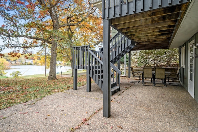 8401 Meadow Lake Rd N, New Hope, MN 55428 - view of patio with stairway and outdoor dining area