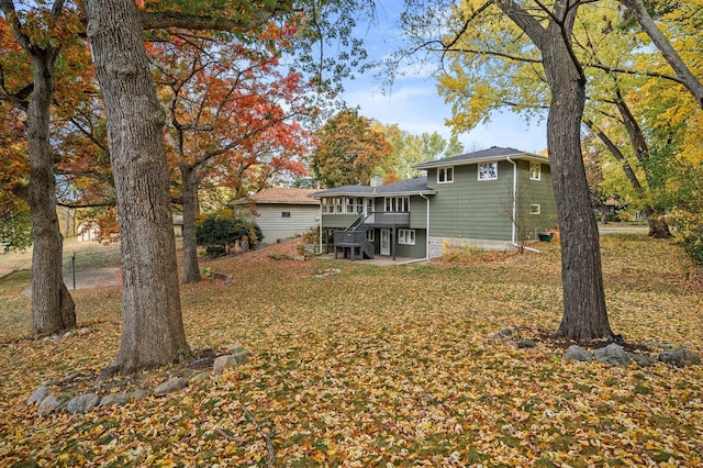 8401 Meadow Lake Rd N, New Hope, MN 55428 - back of house featuring a deck, stairway, a lawn, and a chimney