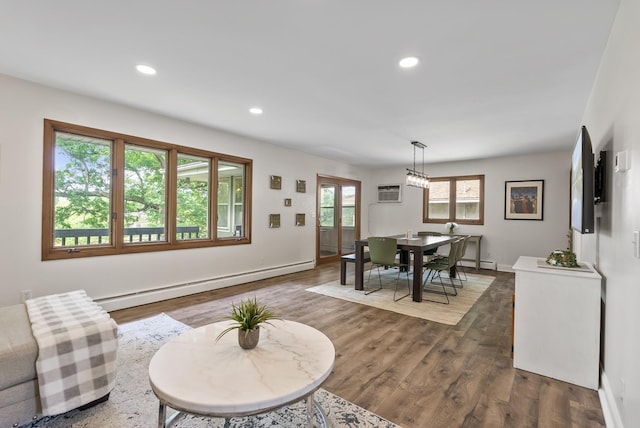 8401 Meadow Lake Rd N, New Hope, MN 55428 - living area featuring a baseboard heating unit, dark wood-style flooring, recessed lighting, and baseboards