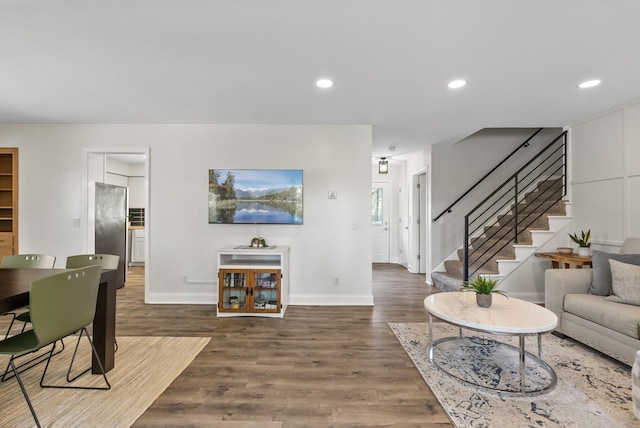 8401 Meadow Lake Rd N, New Hope, MN 55428 - living area featuring stairway, wood finished floors, baseboards, and recessed lighting