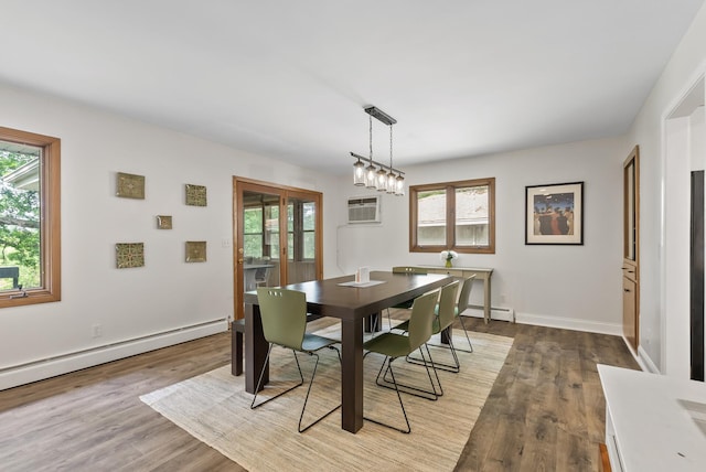 8401 Meadow Lake Rd N, New Hope, MN 55428 - dining room with baseboard heating, healthy amount of natural light, and wood finished floors