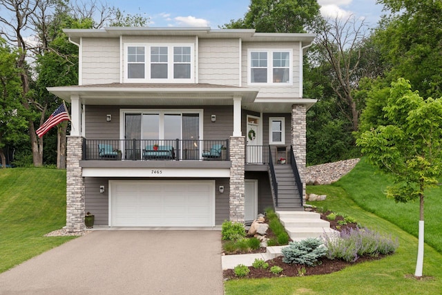7465 Glengarry Pl, Eden Prairie, MN 55344 - view of front facade featuring stairway, driveway, a front yard, a garage, and covered porch