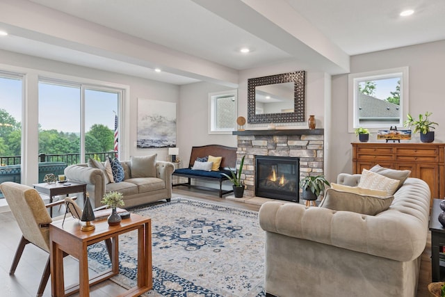 7465 Glengarry Pl, Eden Prairie, MN 55344 - living room featuring recessed lighting, a stone fireplace, and wood finished floors