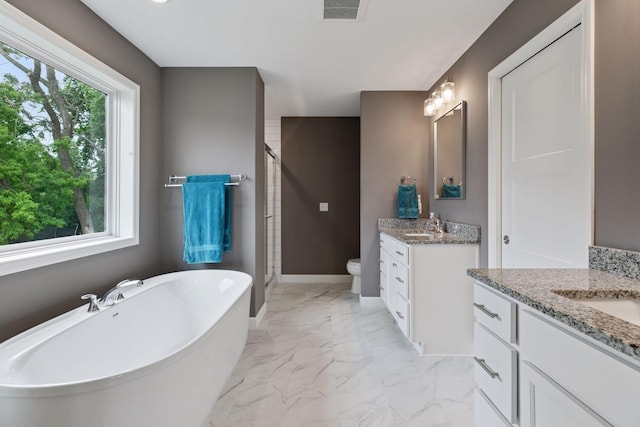 7465 Glengarry Pl, Eden Prairie, MN 55344 - full bathroom featuring marble finish flooring, a stall shower, two vanities, and a freestanding bath