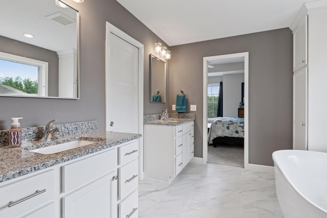 7465 Glengarry Pl, Eden Prairie, MN 55344 - full bath with two vanities, a soaking tub, marble look tiles, and ensuite bath
