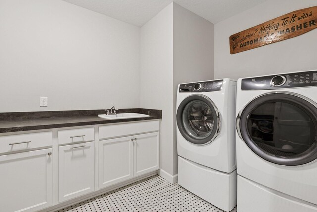 7465 Glengarry Pl, Eden Prairie, MN 55344 - washroom featuring washing machine and dryer, cabinet space, and light flooring