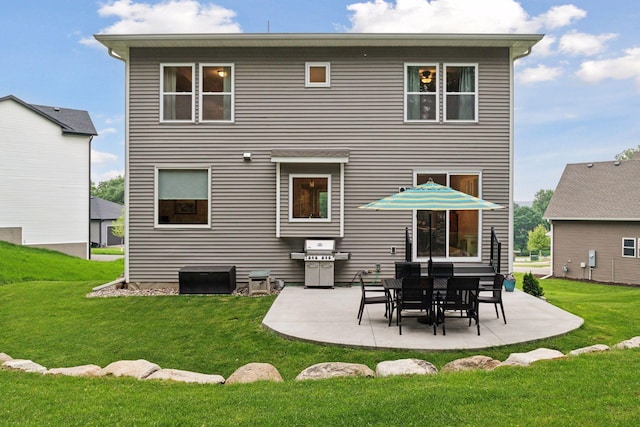 7465 Glengarry Pl, Eden Prairie, MN 55344 - rear view of house featuring a patio area and a lawn