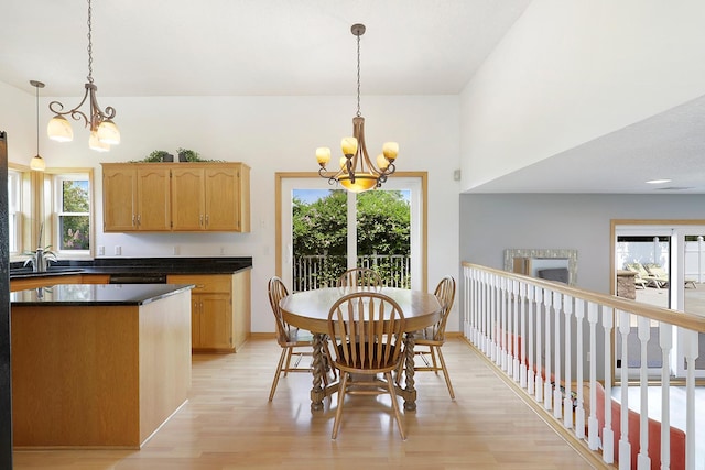 20736 196th Ave NW, Big Lake Twp, MN 55309 - dining room featuring a chandelier, light wood-style floors, and plenty of natural light