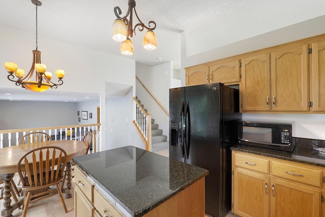 20736 196th Ave NW, Big Lake Twp, MN 55309 - kitchen with black appliances, a chandelier, dark stone countertops, a kitchen island, and decorative light fixtures