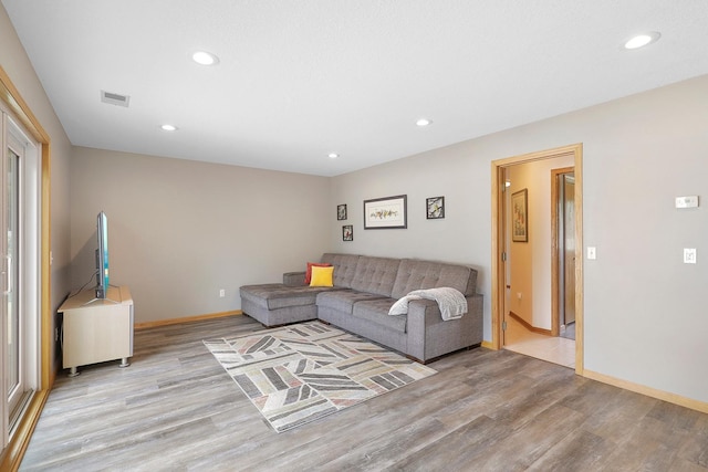 20736 196th Ave NW, Big Lake Twp, MN 55309 - living room with light wood-style floors, recessed lighting, and baseboards