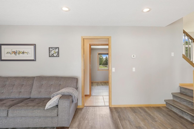20736 196th Ave NW, Big Lake Twp, MN 55309 - living room featuring stairs, wood finished floors, baseboards, and recessed lighting