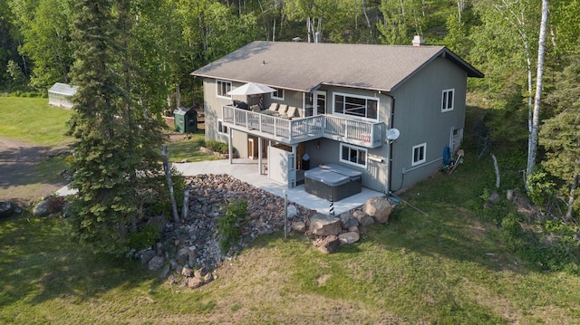 1928 Loop Rd, Two Harbors, MN 55616 - rear view of property with a patio, a wooden deck, roof with shingles, a wooded view, and a lawn