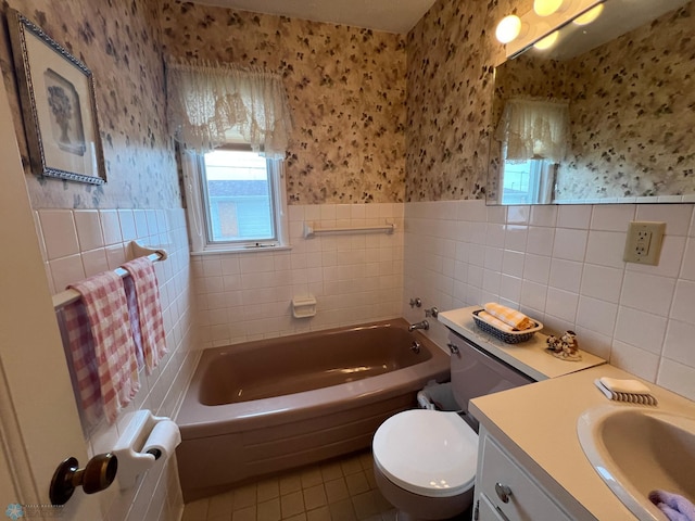 2711 12th St S Unit A2, Fargo, ND 58103 - bathroom with wallpapered walls, tile walls, tile patterned floors, healthy amount of natural light, and a tub