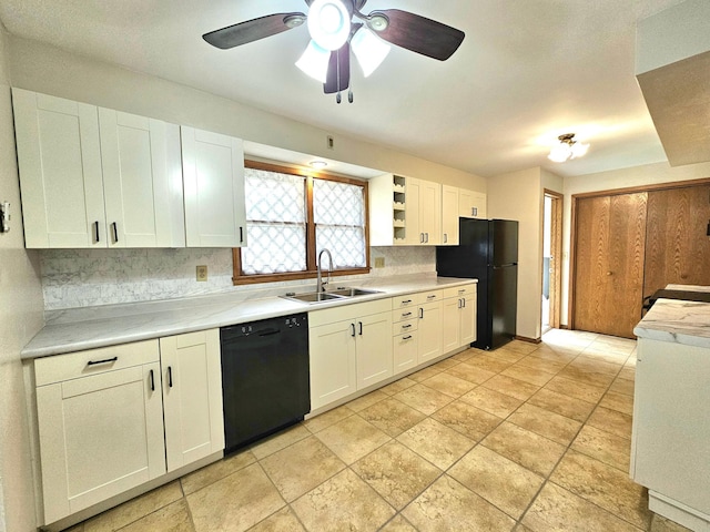 735 Main St N, Hutchinson, MN 55350 - kitchen with black appliances, tasteful backsplash, light countertops, ceiling fan, and white cabinets