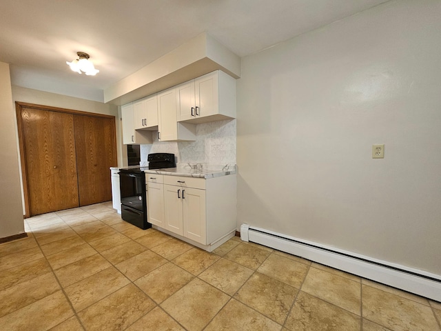 735 Main St N, Hutchinson, MN 55350 - kitchen with black electric range, a baseboard radiator, backsplash, and white cabinetry