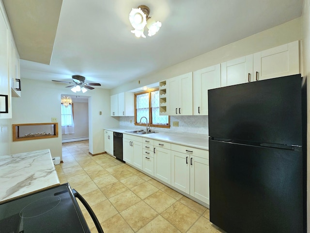735 Main St N, Hutchinson, MN 55350 - kitchen with black appliances, baseboard heating, light countertops, and healthy amount of natural light