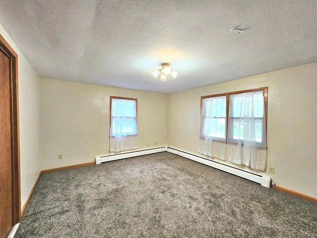 735 Main St N, Hutchinson, MN 55350 - carpeted empty room with a baseboard radiator and a textured ceiling