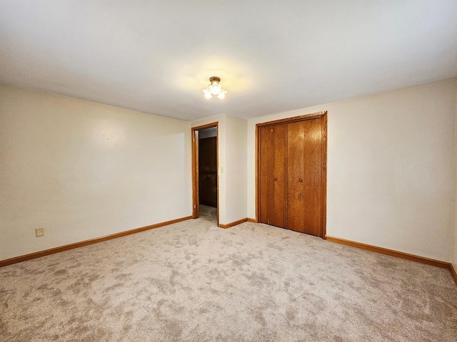735 Main St N, Hutchinson, MN 55350 - unfurnished bedroom featuring carpet flooring and a closet