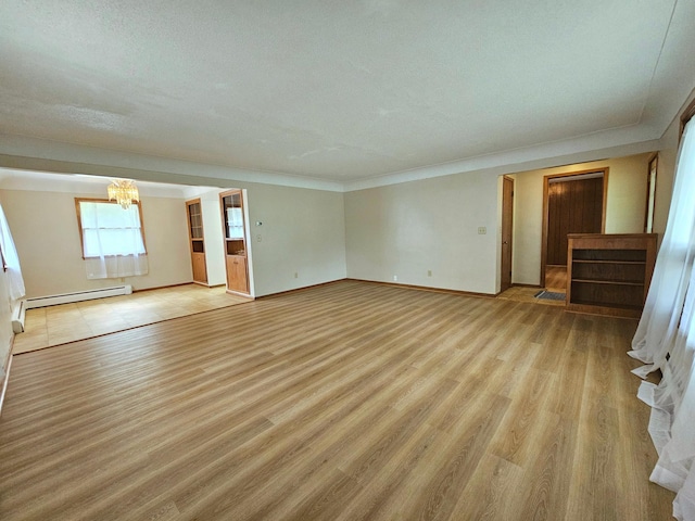 735 Main St N, Hutchinson, MN 55350 - spare room with a baseboard radiator, a chandelier, light wood-style flooring, and ornamental molding