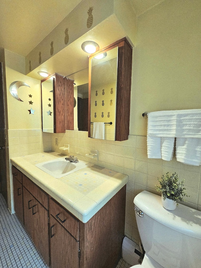 735 Main St N, Hutchinson, MN 55350 - bathroom with vanity, tile walls, tile patterned flooring, and backsplash