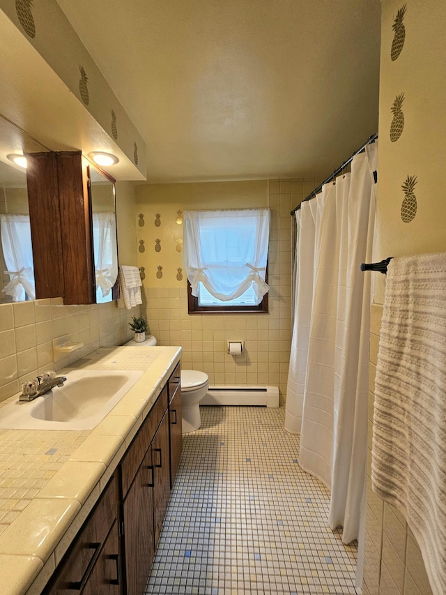 735 Main St N, Hutchinson, MN 55350 - full bathroom with baseboard heating, tile walls, vanity, tile patterned flooring, and a shower with curtain