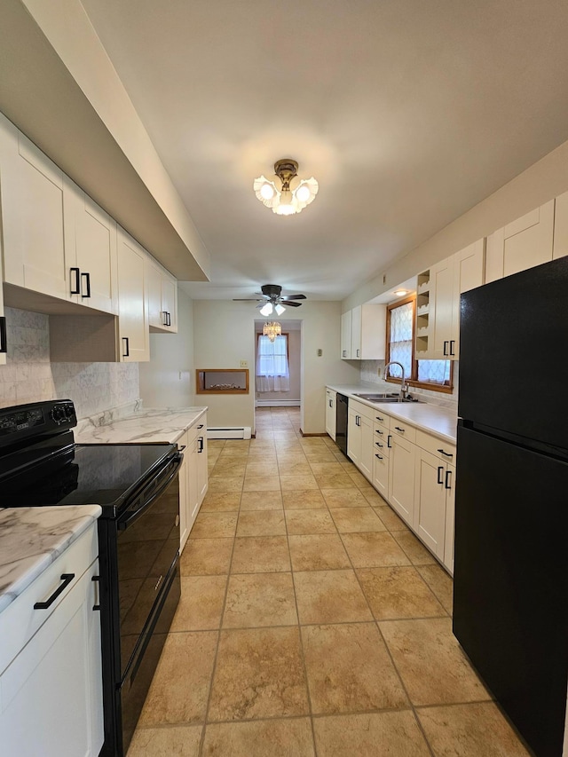 735 Main St N, Hutchinson, MN 55350 - kitchen with black appliances, decorative backsplash, white cabinetry, a ceiling fan, and baseboard heating