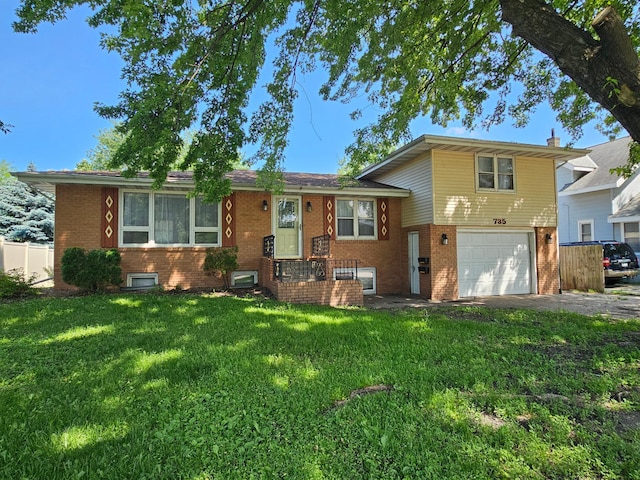 735 Main St N, Hutchinson, MN 55350 - tri-level home featuring brick siding, driveway, and a garage