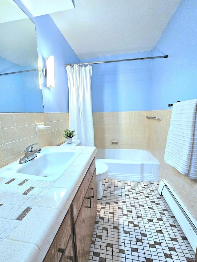 735 Main St N, Hutchinson, MN 55350 - bathroom with tile walls, a baseboard heating unit, vanity, shower / bath combo with shower curtain, and tile patterned floors