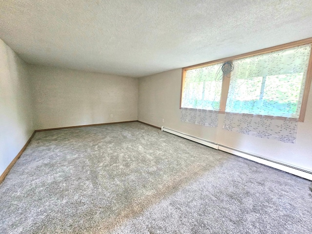 735 Main St N, Hutchinson, MN 55350 - carpeted spare room featuring a baseboard radiator and a textured ceiling