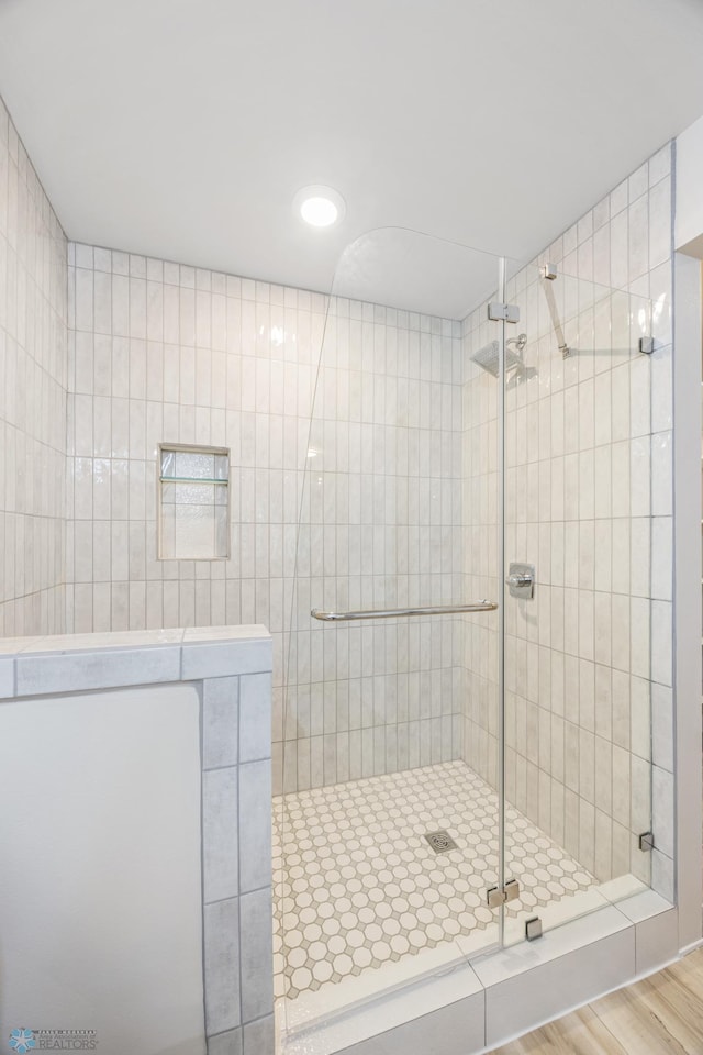 11763 230th St N, Keene Twp, MN 56549 - full bathroom featuring a shower stall and wood finished floors