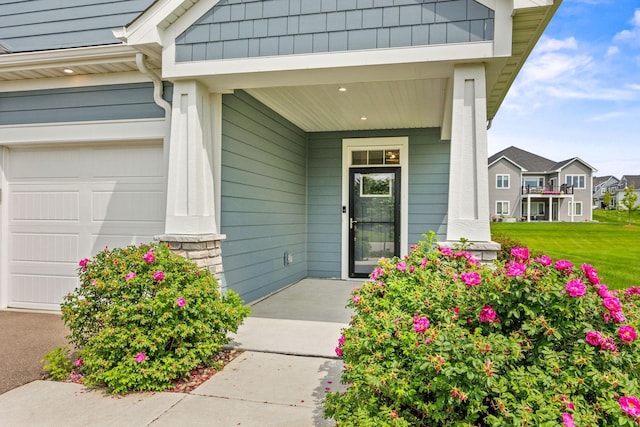 14645 Cloquet St, Dayton, MN 55327 - doorway to property featuring covered porch and a garage