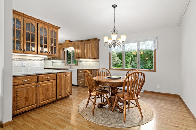 17000 Jackal St NW, Ramsey, MN 55303 - dining space featuring a chandelier and light wood finished floors