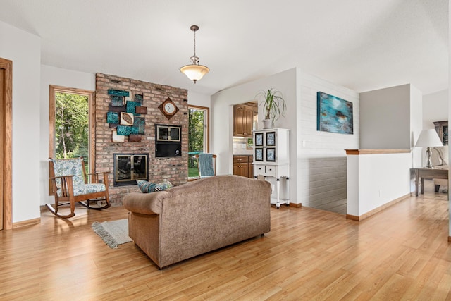 17000 Jackal St NW, Ramsey, MN 55303 - living room with light wood-style floors and a fireplace