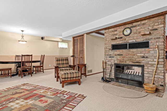 17000 Jackal St NW, Ramsey, MN 55303 - carpeted living area featuring a fireplace and a textured ceiling