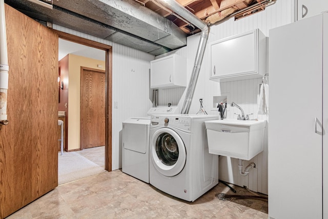 17000 Jackal St NW, Ramsey, MN 55303 - laundry area with cabinet space and washing machine and dryer