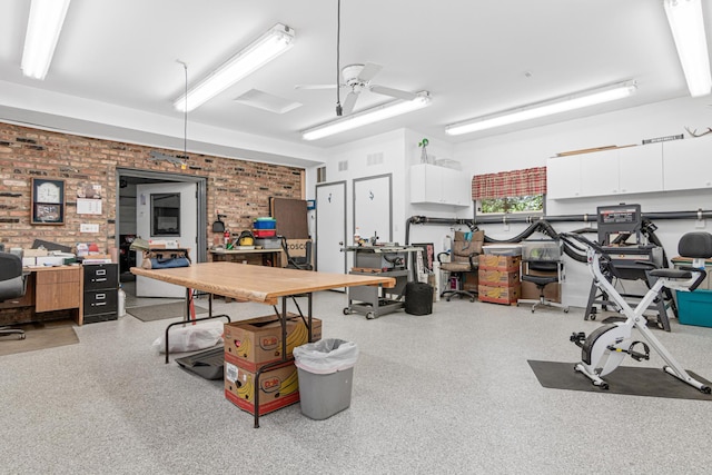17000 Jackal St NW, Ramsey, MN 55303 - garage featuring a ceiling fan and a desk
