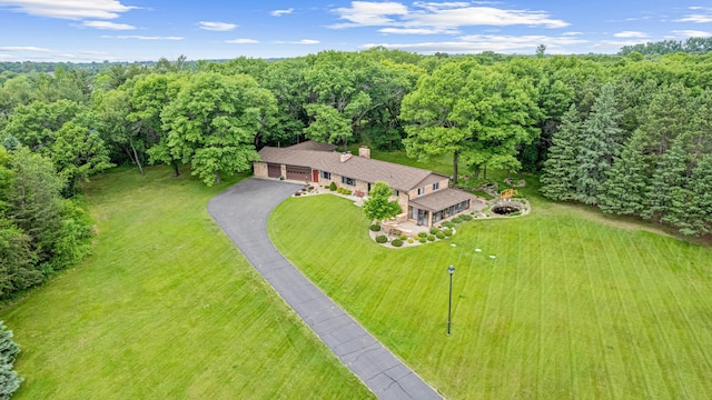 17000 Jackal St NW, Ramsey, MN 55303 - aerial view of property and surrounding area with a heavily wooded area