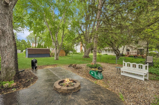2500 Ensign Ave N, Golden Valley, MN 55427 - view of patio with an outdoor fire pit and an outdoor structure