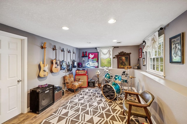 2500 Ensign Ave N, Golden Valley, MN 55427 - sitting room with healthy amount of natural light, wood finished floors, recessed lighting, and a textured ceiling