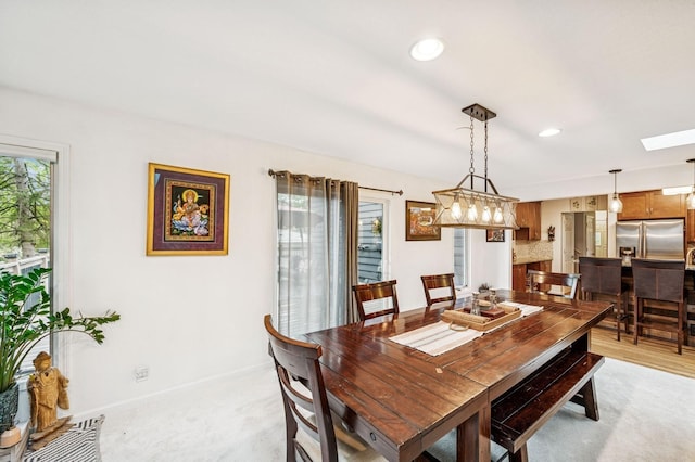 2500 Ensign Ave N, Golden Valley, MN 55427 - dining area featuring a skylight, light colored carpet, and recessed lighting