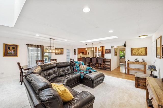 2500 Ensign Ave N, Golden Valley, MN 55427 - living room with a skylight, recessed lighting, a chandelier, and light carpet