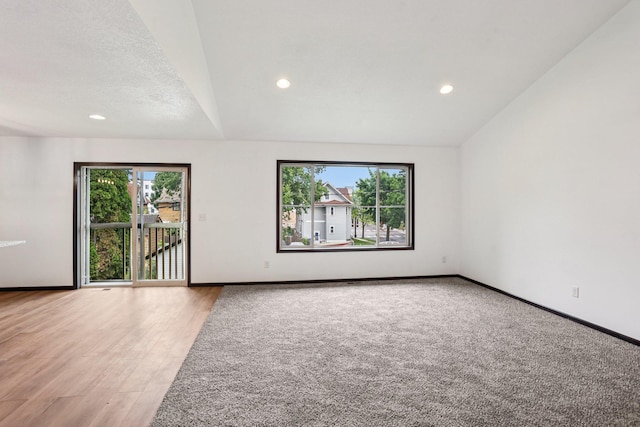 933 Beech St, Saint Paul, MN 55106 - spare room featuring recessed lighting, light wood-style floors, and lofted ceiling