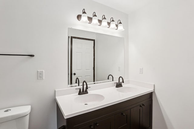 933 Beech St, Saint Paul, MN 55106 - bathroom with double vanity and toilet