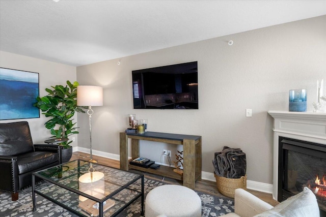 1702 Lakeshore Dr Unit 3, Lake City, MN 55041 - living area with wood finished floors and a lit fireplace