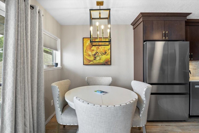1702 Lakeshore Dr Unit 3, Lake City, MN 55041 - dining space with light wood finished floors and a chandelier