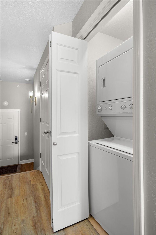 1702 Lakeshore Dr Unit 3, Lake City, MN 55041 - laundry area featuring stacked washer and clothes dryer and light wood-type flooring