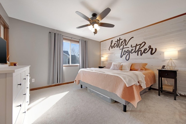 1105 Pioneer Trl SE, Cambridge, MN 55008 - bedroom featuring light carpet, ceiling fan, and wood walls