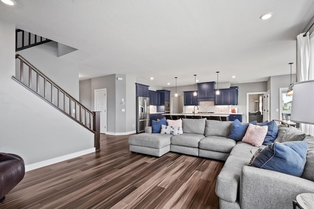 1401 142nd Ct E, Rosemount, MN 55068 - living area featuring dark wood-style floors, baseboards, stairs, and recessed lighting